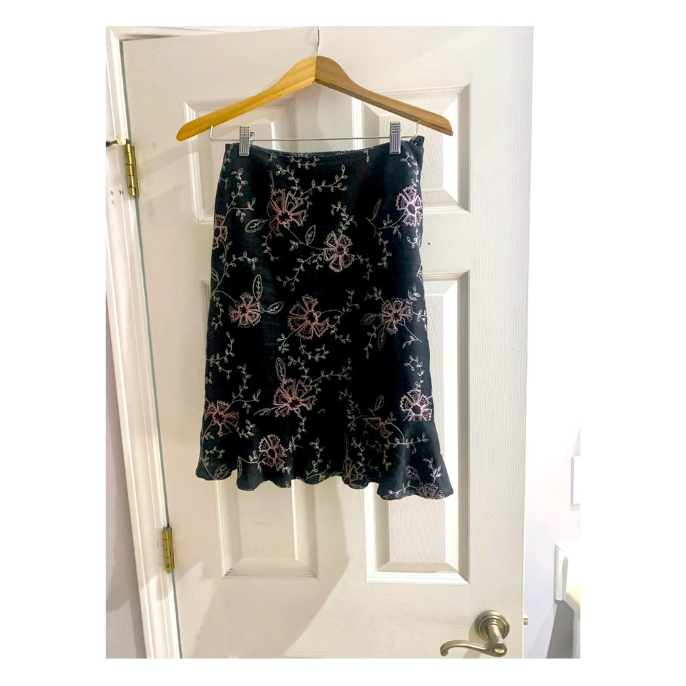 Grace Elements used embroidered ladies’ skirt with ruffle hem. Knee length.